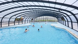 Guests swim in Haven Hopton's new covered outdoor pool