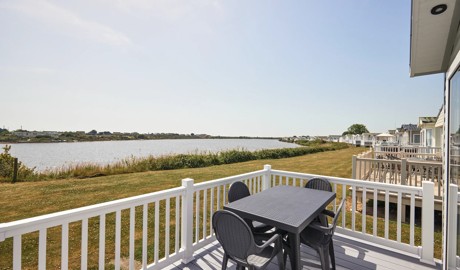 Lake views from the deck of a Lodge holiday home at Church Farm Holiday Park, Sussex.
