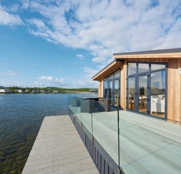 A lakeside lodge in the Tarka Holt area of Lakeland Leisure Park.