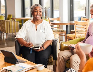 Couple speaking to a Caravan Sales advisor