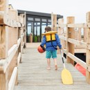 The jetty at the lake and canadian canoes