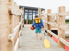 The jetty at the lake and canadian canoes
