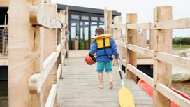 The jetty at the lake and canadian canoes