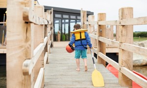 The jetty at the lake and canadian canoes