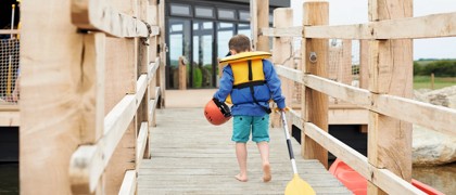 The jetty at the lake and canadian canoes