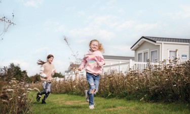 One of the accommodation areas at Seton Sands with lovely planting near the holiday home