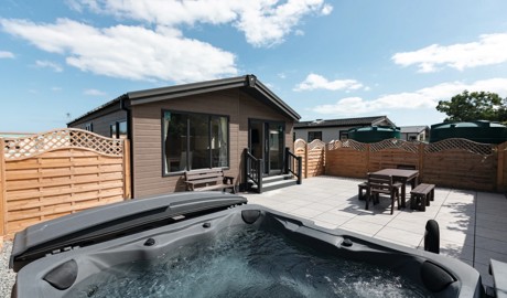A stunning lodge with patio and hot tub at Golden Sands Holiday Park, Mablethorpe.