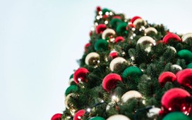 Baubles adorn a festive Christmas tree.