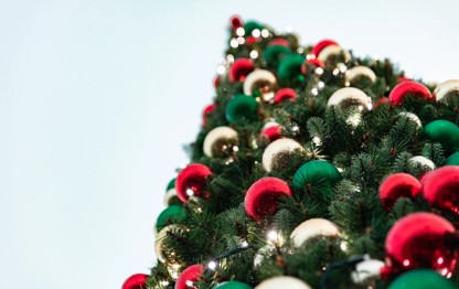 Baubles adorn a festive Christmas tree.