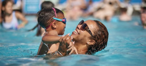 Outdoor pool and the sunloungers around the pool edges.