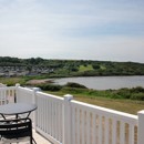 Deck on a sea view holiday home at Littlesea
