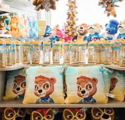 A young holidaymaker is shown a Rory toy