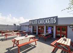 Outdoor seating area of Slim Chickens