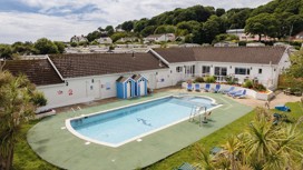 The outdoor pool at Penally Court holiday park.