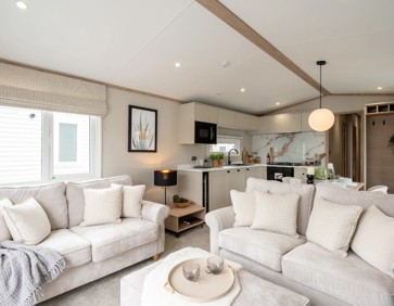 The comfortable lounge inside a Voctory Harraway caravan model.