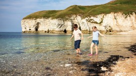 Paddling at the beach near Thornwick Bay