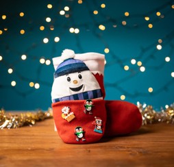 A snowman-themed stocking handmade at Haven.