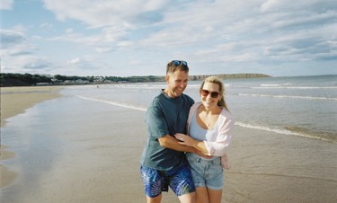 A couple together on the beach at Primrose Valley in Yorkshire.