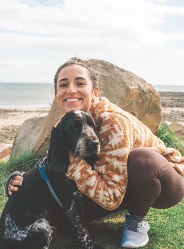 A dog being playful at the Adventure Village