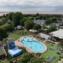 An aerial view of Burnham-on-Sea's Adventure village, with the coastline just visible behind it.