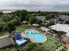 An aerial view of Burnham-on-Sea's Adventure village, with the coastline just visible behind it.