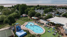 An aerial view of Burnham-on-Sea's Adventure village, with the coastline just visible behind it.