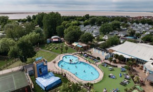 An aerial view of Burnham-on-Sea's Adventure village, with the coastline just visible behind it.