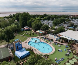 An aerial view of Burnham-on-Sea's Adventure village, with the coastline just visible behind it.