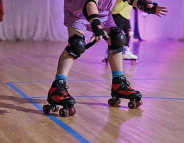 Children enjoying roller disco at Combe Haven