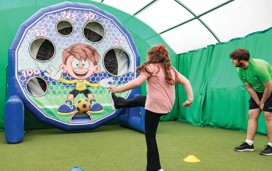 Children between 5-12 years playing football together with Football Fun Factory.