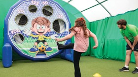 Children between 5-12 years playing football together with Football Fun Factory.