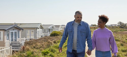 A family enjoy a nature walk at Church Farm Holiday Park, Sussex.