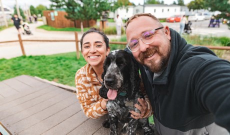 Dog with his owner on a caravan decking