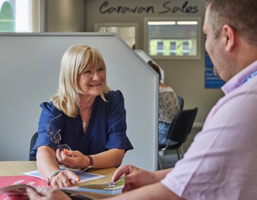 Chatting about caravans for sale in the Sales Office at Cleethorpes Beach