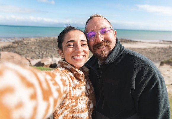 A couple take a selfie by the sea in North Wales.