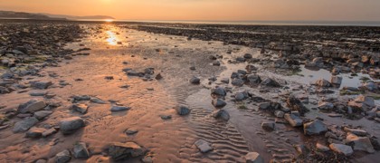 The rocky beach at Doniford Bay