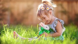 Cute little girl with a bunny rabbit