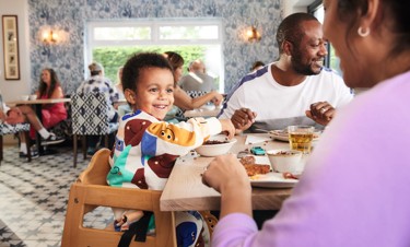 A family enjoying breakfast at The Richmond Arms bar and restaurant in Skegness Holiday Park