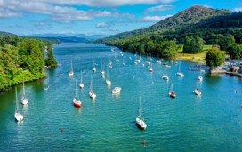 An aerial view of Lake Windermere in Lake District where people are sailing in boats
