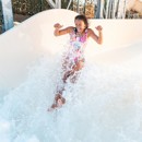 A teenage girl tests out the new Atlantis Falls water slide at Haven's Kent Cost holiday park.