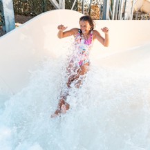 A teenage girl tests out the new Atlantis Falls water slide at Haven's Kent Cost holiday park.