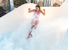 A teenage girl tests out the new Atlantis Falls water slide at Haven's Kent Cost holiday park.