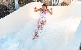 A teenage girl tests out the new Atlantis Falls water slide at Haven's Kent Cost holiday park.