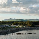 Seafront caravans with mountains in the distance