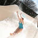 A teenage girl tests out the new Atlantis Falls water slide at Haven's Kent Cost holiday park.