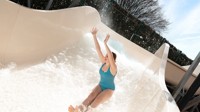 A teenage girl tests out the new Atlantis Falls water slide at Haven's Kent Cost holiday park.