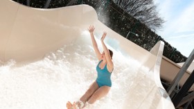 A teenage girl tests out the new Atlantis Falls water slide at Haven's Kent Cost holiday park.