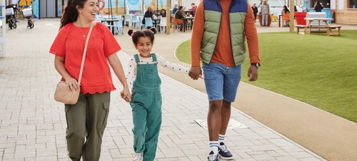 Family walking through the piazza at Skegness Holiday Park