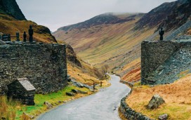 Honister Slate Mine in Lake District with a stone wall and pathway