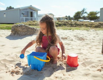 Jumping for joy on holiday at Hopton Holiday Park, Norfolk.